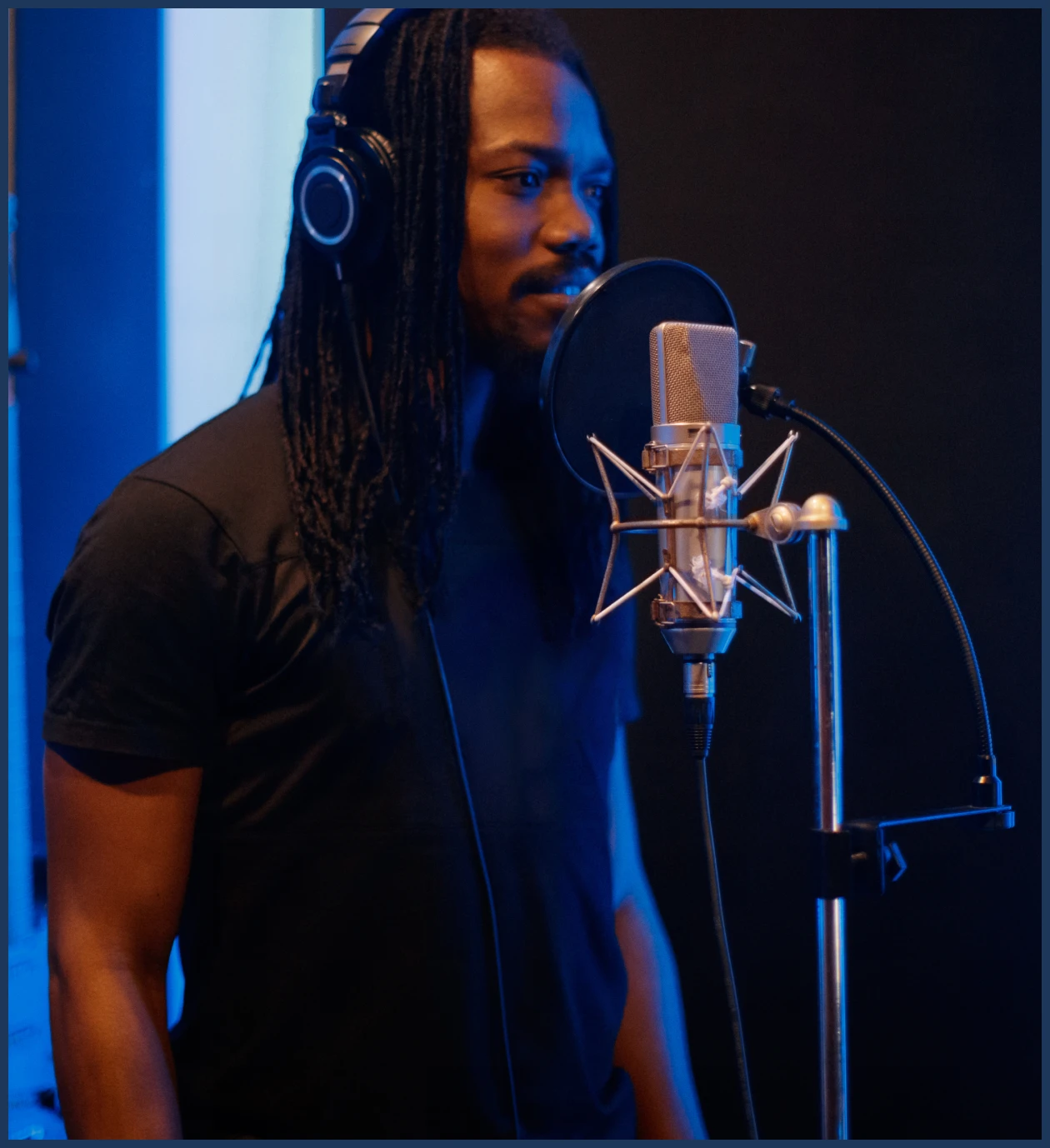 Man wearing headphones singing